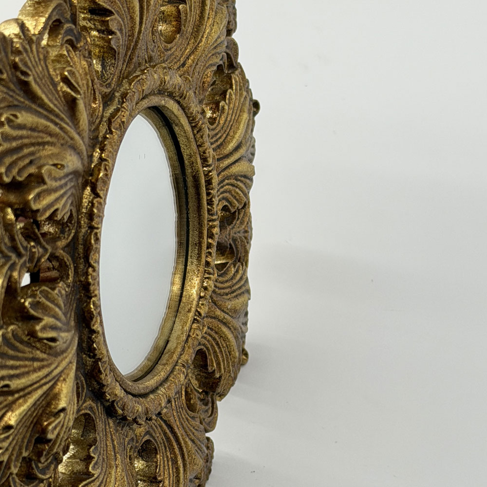 Antiqued ornate gold mirror