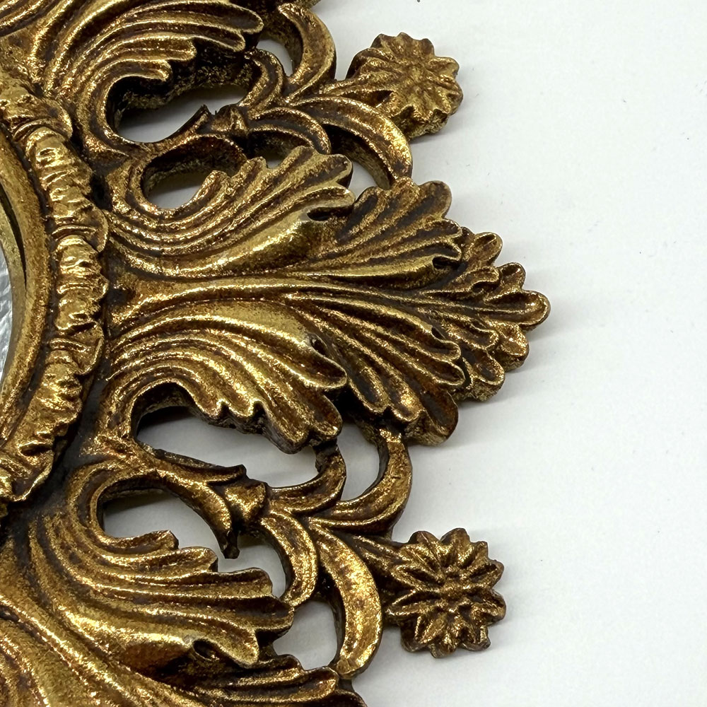 Antiqued ornate gold mirror